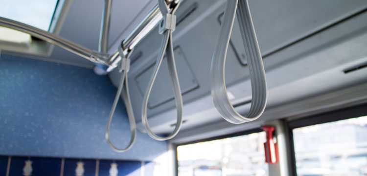 Handles on a bus.